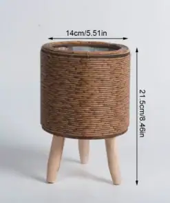 The Rattan Planter Stand is a chic, round wicker side table with wooden legs, 14cm diameter and 21.5cm high. | 28Alchemy