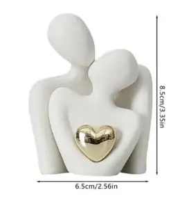 Minimalist sculpture of two abstract people embracing with a gold heart, measuring 8.5 cm tall and 6.5 cm wide. | 28Alchemy