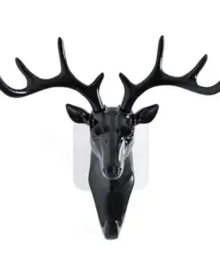 Black decorative deer head with large antlers mounted on a white wall. | 28Alchemy