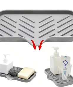 Gray plastic slotted tray with angled grooves, shown draining water; used for holding soap, sponges, and toiletries. | 28Alchemy