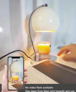 A hand reads near a desk lamp and candle, with a phone capturing the scene; text advises using natural light. | 28Alchemy