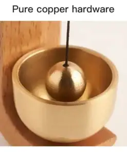 Close-up of a shiny copper bowl with a suspended copper ball inside, labeled "Pure copper hardware. | 28Alchemy