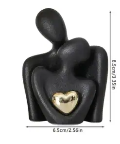 Black abstract couple figurine with a gold heart, measuring 8.5cm tall and 6.5cm wide. | 28Alchemy