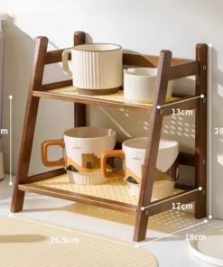 Two-tier wooden shelf holding cups, with measurements labeled for height, width, and depth on each shelf. | 28Alchemy