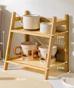 Two-tier wooden shelf holding ceramic mugs and bowls, with labeled measurements of each section in centimeters. | 28Alchemy