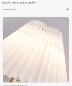 Close-up of a pleated, white fabric lampshade with soft, warm lighting and a minimal, modern design. | 28Alchemy