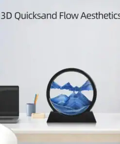 A circular 3D quicksand art piece with blue sand sits on a desk near a laptop and pen holder. | 28Alchemy