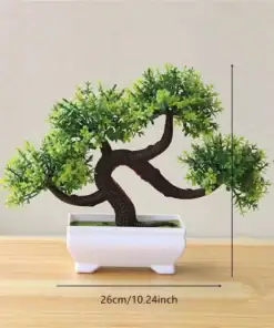 Artificial bonsai tree in a white pot on a wood surface, measuring 19cm tall and 26cm wide. | 28Alchemy