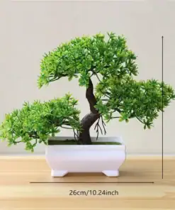 Small artificial bonsai tree in a white pot on a wooden surface, measuring 19cm tall and 26cm wide. | 28Alchemy