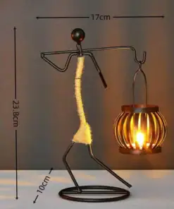 Metal sculpture of a person holding a lantern, with dimensions: 23.8cm tall, 17cm wide, base 10cm. | 28Alchemy