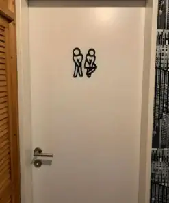 White door with a restroom sign showing two figures crossing their legs, indicating urgency to use the bathroom. | 28Alchemy