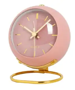 A round pink and gold analog clock with gold hands and numbers on a matching gold stand. | 28Alchemy