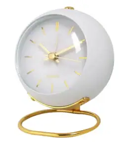 White round alarm clock with gold hands, hour marks, and a gold stand, isolated on a white background. | 28Alchemy