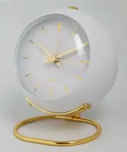 White and gold modern round desk clock with gold hour markers, sitting on a curved gold stand, against a plain background. | 28Alchemy