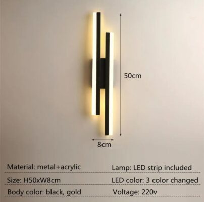 Effortless Elegance Wall Lamp: black & gold LED, 50cm x 8cm, casts a warm glow on a beige wall. | 28Alchemy
