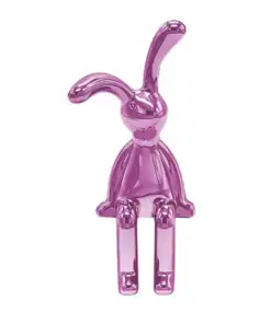 A shiny, pink, abstract rabbit figure with long ears, sitting with legs extended and arms at its sides. | 28Alchemy