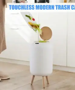 Person dumping food scraps into a white touchless modern trash can with wooden legs in a kitchen. | 28Alchemy