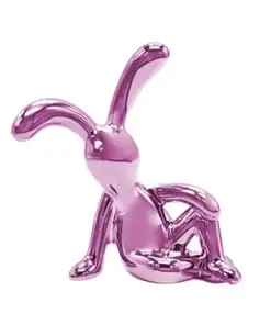 Shiny pink metallic bunny figurine lounging with one knee raised against a plain white background. | 28Alchemy