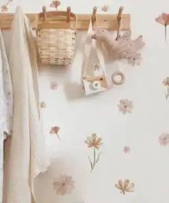 Wooden hooks with hanging basket, fabric bird, toy camera, and light towels; floral wall decals in soft pastel colors. | 28Alchemy