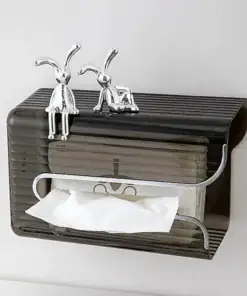 Black tissue box holder with two metallic rabbit figurines sitting on top, mounted on a white wall. | 28Alchemy
