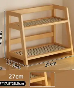 Two-tier wooden shelf with perforated shelves, measuring 27x17.5x28.5 cm, placed on a desk near a lamp. | 28Alchemy