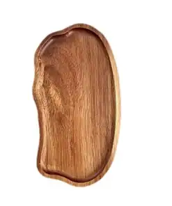 A wooden serving tray with an irregular, organic shape, shown on a white background. | 28Alchemy