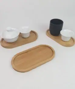 Three bamboo trays, each holding ceramic cups; one tray is empty, against a plain white background. | 28Alchemy