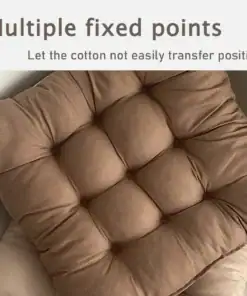 Brown tufted cushion with multiple fixed points to keep the cotton filling in place, placed on a beige chair. | 28Alchemy