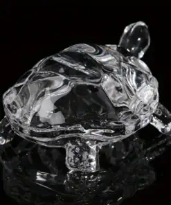 A clear glass turtle figurine with detailed legs, head, and shell, displayed on a black reflective surface. | 28Alchemy