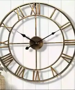 A round wall clock with gold Roman numerals on a white wall, showing the time as 10:10. | 28Alchemy