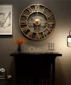 Large wall clock with Roman numerals above a shelf with decor, a vase, sculptures, and a modern wall lamp lit on the right. | 28Alchemy