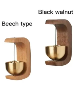 Two wooden wall-mounted spoon holders, one in beech and one in black walnut, each holding a brass spoon. | 28Alchemy