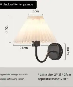 Wall-mounted lamp with a pleated white shade, black base, and listed dimensions and specifications on display. | 28Alchemy