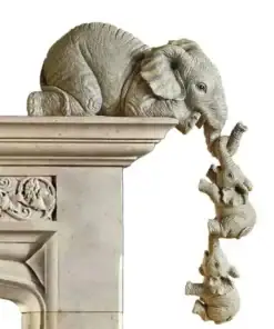 Three stone elephant sculptures hang off a ledge, each holding the other's trunk, against a plain white background. | 28Alchemy